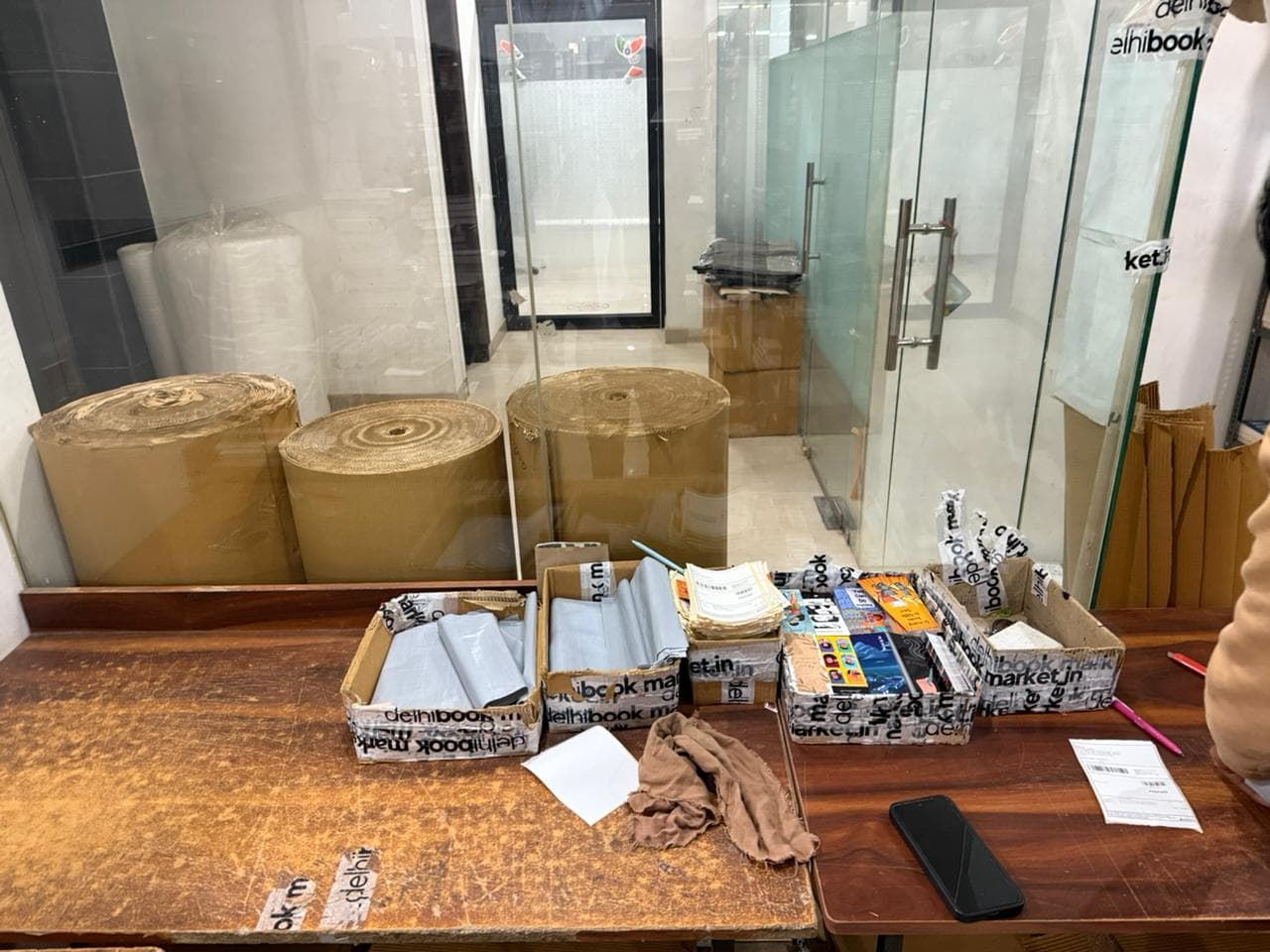 Packing station with organized supplies and branded packaging